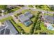 Overhead view of the property showing lush landscaping, pool with screened enclosure, and spacious yards at 2060 Woodburn Dr., Myrtle Beach, SC 29579