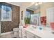 Bathroom featuring mosaic tile, a white vanity, and decorative accents at 2060 Woodburn Dr., Myrtle Beach, SC 29579