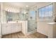 Modern bathroom with a glass shower, double vanity, and elegant fixtures at 2060 Woodburn Dr., Myrtle Beach, SC 29579