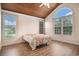 Cozy bedroom featuring wood-paneled ceiling and an arched window letting in natural light at 2060 Woodburn Dr., Myrtle Beach, SC 29579