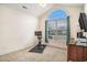 Minimalist bedroom with an exercise bike, large window, and a view of the neighborhood at 2060 Woodburn Dr., Myrtle Beach, SC 29579