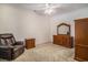 Bedroom featuring a plush recliner, ceiling fan and wooden furniture at 2060 Woodburn Dr., Myrtle Beach, SC 29579