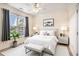 Bright bedroom with large window, stylish decor, and a comfortable bed at 2060 Woodburn Dr., Myrtle Beach, SC 29579