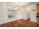 Dining room featuring large window overlooking the pool and hardwood floors at 2060 Woodburn Dr., Myrtle Beach, SC 29579