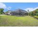 A lovely fenced-in pool area is surrounded by a well-kept lawn and mature trees at 2060 Woodburn Dr., Myrtle Beach, SC 29579