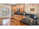 Traditional kitchen featuring light wood cabinets, granite countertops, stainless steel appliances and hardwood floors at 2060 Woodburn Dr., Myrtle Beach, SC 29579