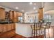 Kitchen with bar seating, warm wood cabinets, stainless steel appliances, and granite countertops at 2060 Woodburn Dr., Myrtle Beach, SC 29579