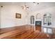Spacious living room boasts hardwood floors, a fireplace, and arched windows with plenty of natural light at 2060 Woodburn Dr., Myrtle Beach, SC 29579