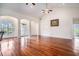 Spacious living room showcases hardwood floors and lots of natural light and arched doorway at 2060 Woodburn Dr., Myrtle Beach, SC 29579