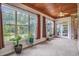 Bright sunroom with large windows, plants, and natural light at 2060 Woodburn Dr., Myrtle Beach, SC 29579