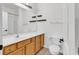Bathroom featuring vanity with wood cabinets, a large mirror, and tile flooring at 2061 Silvercrest Dr. # 7E, Myrtle Beach, SC 29579