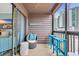 Relaxing condo balcony featuring seating, ocean views, and sliding glass door at 207 N Ocean Blvd. # 342, North Myrtle Beach, SC 29582