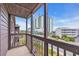 Condo balcony overlooking the street with a partial view of a building at 207 N Ocean Blvd. # 342, North Myrtle Beach, SC 29582