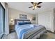 Bedroom features a plush queen bed with accent pillows, a ceiling fan, and a nearby closet at 207 N Ocean Blvd. # 342, North Myrtle Beach, SC 29582
