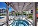 Hot tub beneath a wooden pergola, surrounded by lounge chairs and landscaping at 207 N Ocean Blvd. # 342, North Myrtle Beach, SC 29582