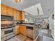 Well-equipped kitchen featuring stainless steel appliances and a breakfast bar at 207 N Ocean Blvd. # 342, North Myrtle Beach, SC 29582