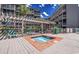 Inviting outdoor hot tub surrounded by a wooden deck and comfortable lounge chairs, perfect for relaxation at 207 N Ocean Blvd. # 342, North Myrtle Beach, SC 29582