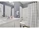 Neat bathroom featuring a white vanity and a shower/tub combination with a stylish patterned curtain at 211 76Th Ave. N # A3, Myrtle Beach, SC 29572