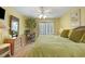 Comfortable bedroom featuring a work space, balcony access, and abundant natural light at 211 76Th Ave. N # A3, Myrtle Beach, SC 29572