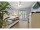 Comfortable bedroom featuring a trundle bed, ceiling fan and access to a private balcony at 211 76Th Ave. N # A3, Myrtle Beach, SC 29572