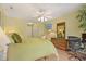 Inviting bedroom with desk space, TV, and ceiling fan for optimal comfort at 211 76Th Ave. N # A3, Myrtle Beach, SC 29572