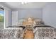 Comfortable bedroom with two beds and a private door to a balcony at 211 76Th Ave. N # A3, Myrtle Beach, SC 29572