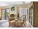 Cozy dining area featuring wicker chairs, a glass table, and natural light from a balcony at 211 76Th Ave. N # A3, Myrtle Beach, SC 29572