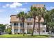 Inviting villa exterior with quaint balconies, lush lawn, and vibrant landscaping at 211 76Th Ave. N # A3, Myrtle Beach, SC 29572