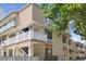 A view of the exterior of the units showing the entrances, balconies and landscaping at 211 76Th Ave. N # A3, Myrtle Beach, SC 29572