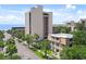 Scenic street view showing the villa with palm trees, lawn, and surrounding buildings at 211 76Th Ave. N # A3, Myrtle Beach, SC 29572