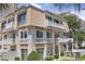Charming multi-story villa with balconies, manicured lawn, and vibrant landscaping at 211 76Th Ave. N # A3, Myrtle Beach, SC 29572