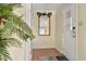 Hallway with a decorative mirror and neutral color scheme leading to the front door at 211 76Th Ave. N # A3, Myrtle Beach, SC 29572