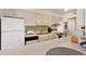 The kitchen features a breakfast bar and modern appliances, including a stacked washer/dryer unit at 211 76Th Ave. N # A3, Myrtle Beach, SC 29572