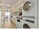 The kitchen features a stacked washer/dryer unit and breakfast bar leading to the outdoor patio at 211 76Th Ave. N # A3, Myrtle Beach, SC 29572