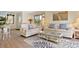 Bright living room with cozy seating, stylish rug, and access to a balcony with a view at 211 76Th Ave. N # A3, Myrtle Beach, SC 29572