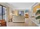 Bright living room showing balcony access, stylish decor, and an open layout to the breakfast bar at 211 76Th Ave. N # A3, Myrtle Beach, SC 29572