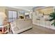 Open-concept living area with comfortable seating, balcony access, and a breakfast bar at 211 76Th Ave. N # A3, Myrtle Beach, SC 29572