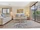 Inviting living room featuring comfortable sofas, beach-themed decor, and sliding glass doors to the outside at 211 76Th Ave. N # A3, Myrtle Beach, SC 29572