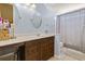Charming bathroom with wood vanity, decorative mirrors, and a shower-tub combination at 2280 Andover Dr. # C, Surfside Beach, SC 29575
