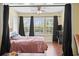 Bright bedroom features natural light and ample space, creating a serene atmosphere for relaxation at 2280 Andover Dr. # C, Surfside Beach, SC 29575