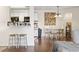 An inviting dining area featuring a wooden table, comfortable seating, and laminate wood flooring at 2280 Andover Dr. # C, Surfside Beach, SC 29575