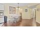 Well-lit dining area with laminate wood flooring and a neutral color scheme for a cozy ambiance at 2280 Andover Dr. # C, Surfside Beach, SC 29575