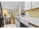 Well-maintained kitchen next to dining area with white cabinets and modern appliances at 2280 Andover Dr. # C, Surfside Beach, SC 29575