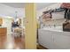 Laundry area is conveniently located and includes washer, dryer, and storage shelves at 2280 Andover Dr. # C, Surfside Beach, SC 29575