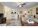 Spacious living room that flows into dining area, featuring a ceiling fan and comfortable seating at 2280 Andover Dr. # C, Surfside Beach, SC 29575