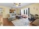 Comfortable living room featuring a ceiling fan and cozy seating, opening to the connected bedroom at 2280 Andover Dr. # C, Surfside Beach, SC 29575
