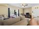 Comfortable living room featuring a ceiling fan and cozy seating, opening to the connected bedroom at 2280 Andover Dr. # C, Surfside Beach, SC 29575