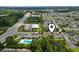 Community aerial showcasing lush landscaping, pool, and convenient location at 2280 Andover Dr. # L, Surfside Beach, SC 29575
