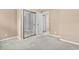Neutral bedroom with mirrored closet doors and carpeted floor at 2280 Andover Dr. # L, Surfside Beach, SC 29575