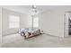 Bedroom features two windows, ceiling fan and neutral walls and carpet at 2280 Andover Dr. # L, Surfside Beach, SC 29575